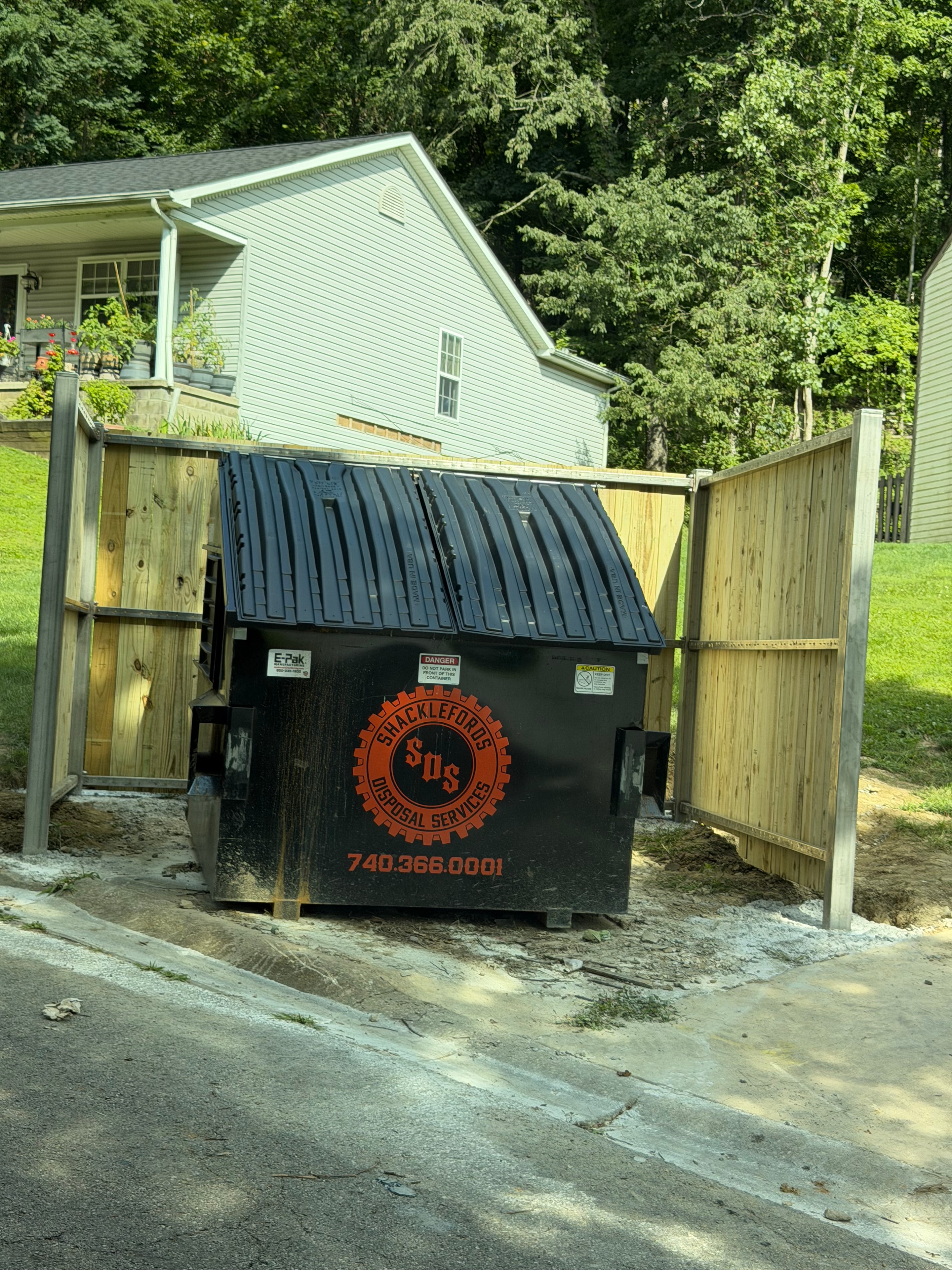 Completed trash enclosure with dumpster installed